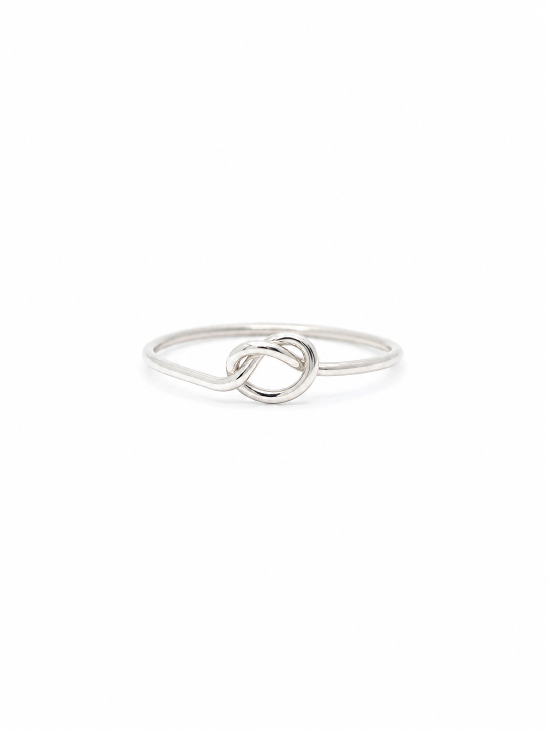 Silver knot ring on a white background